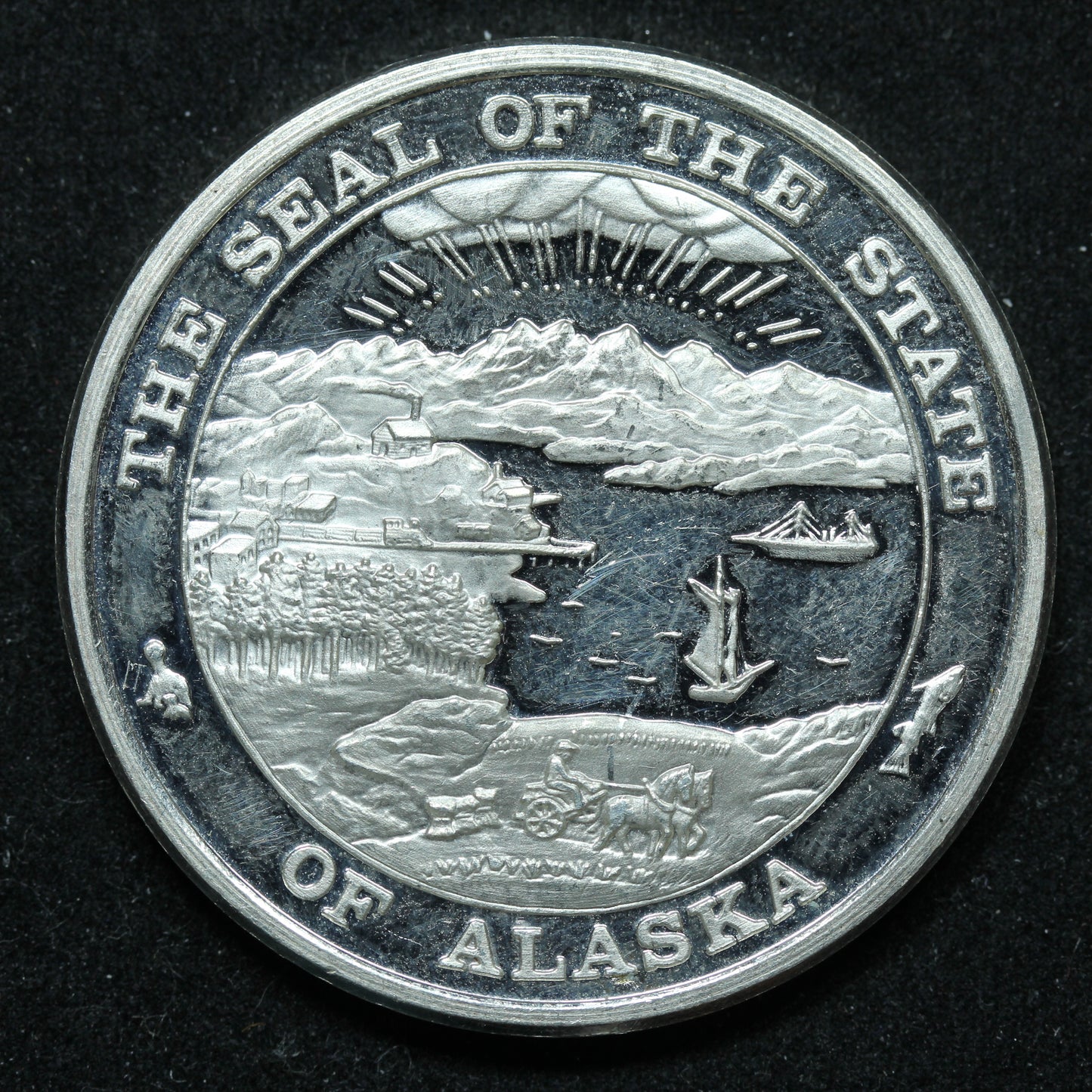 1996 1 oz .999 Fine Silver - The Seal of The State of Alaska Prospector w/ Gold Nugget