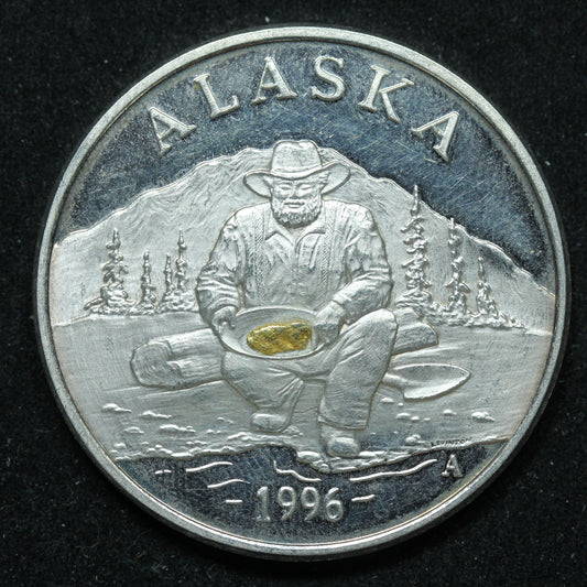 1996 1 oz .999 Fine Silver - The Seal of The State of Alaska Prospector w/ Gold Nugget