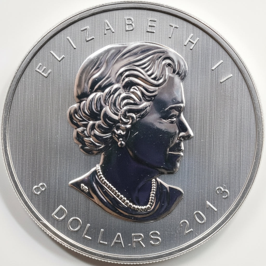 Silver coin with a profile of a person and 'Elizabeth II' text, dated 2013.