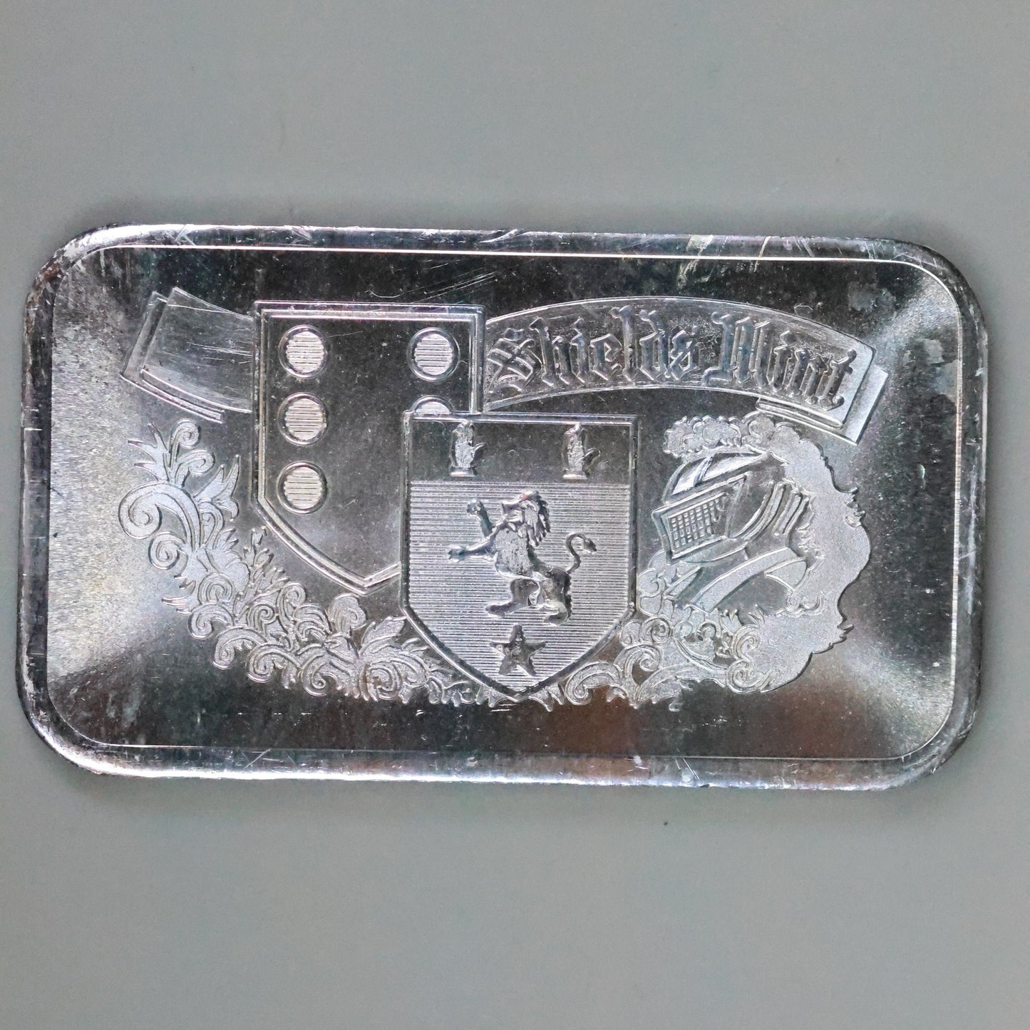 1 oz .999 Fine Silver Shields Mint Art Bar w/ Plastic Cover